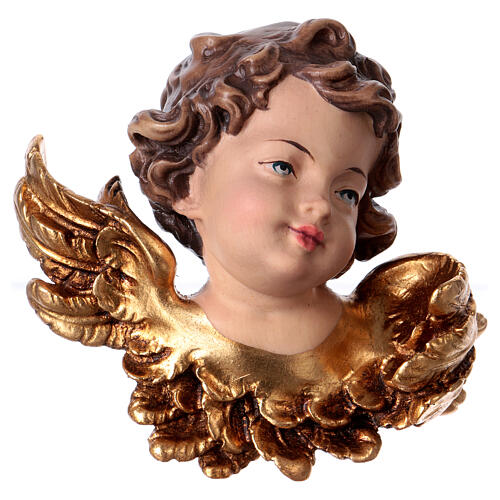 Angel head statue looking left in Valgardena wood 1