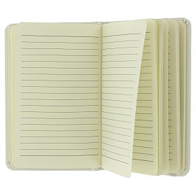 White notebook with Jubilee 2025 Latin official logo, white elastic band