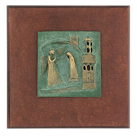 Annonciation bronze tile of San Zeno of Verona on antique finish wood