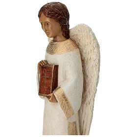 Angel figurine with book for rural crèche