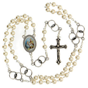Wedding souvenir, silver rosary and wedding rings