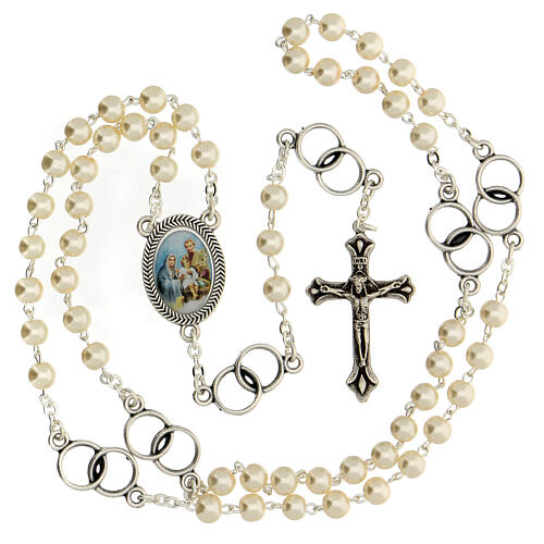 Wedding souvenir, silver rosary and wedding rings 2