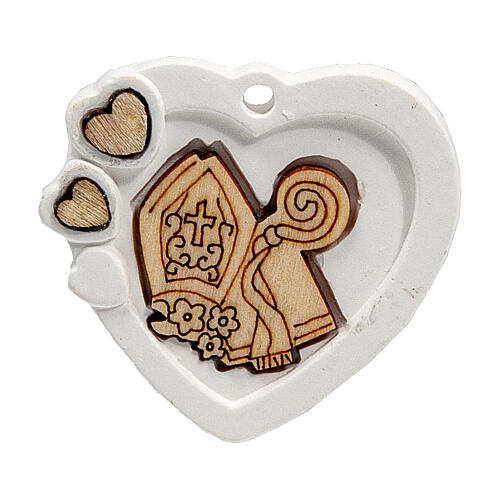 Heart-shaped charm with mitre and crozier, plaster, 1.5 in 1