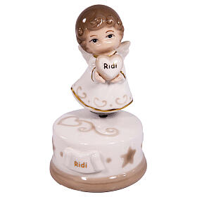 Porcelain angel-shaped music box, religious favour, h 5 in