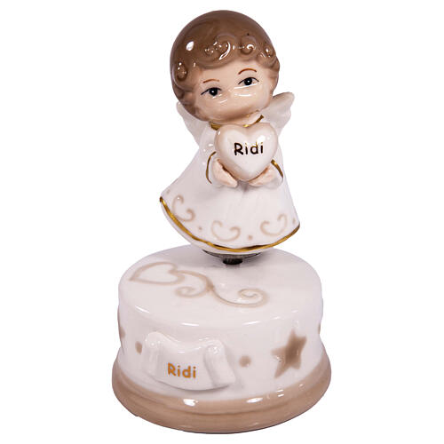Porcelain angel-shaped music box, religious favour, h 5 in 1