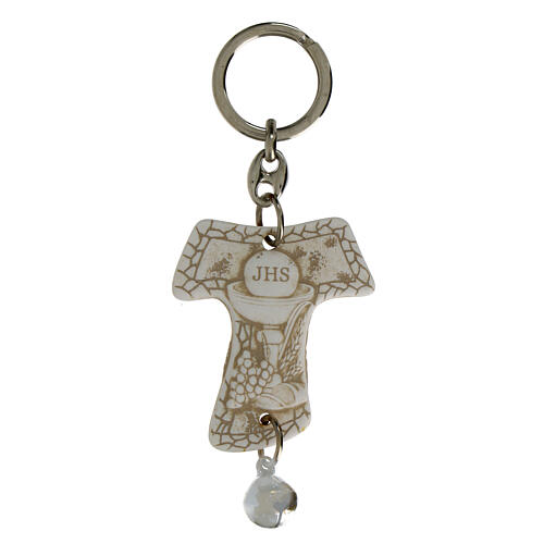 Tau-shaped keychain with chalice image and white bell, resin, h 5 in 1