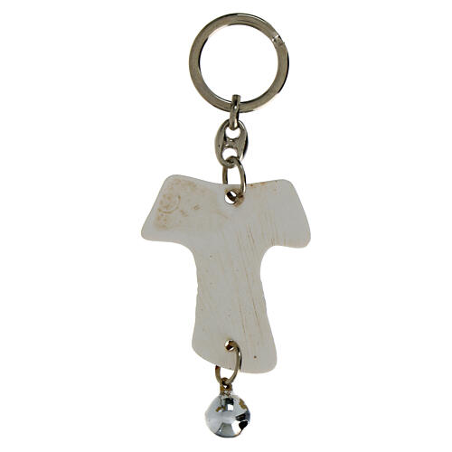 Tau-shaped keychain with chalice image and white bell, resin, h 5 in 2