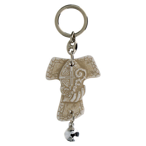 Tau-shaped keychain with Confirmation symbols and white bell, resin, h 5 in 1