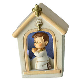 Communion favor boy praying in church