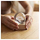 Crystal sphere with hands forming heart, square base 6 cm s2