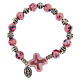 Elastic bracelet with ceramic grains 10x8 mm and pink cross s1