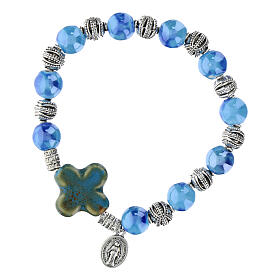 Elastic bracelet with ceramic grains 10x8 mm and light blue cross