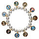 Pulsera perla blanca con santos s1
