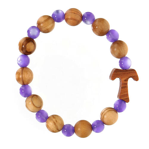 Elastisches Tau-Armband mit Zehner aus Assisi-Holz und mit lila kleinen Perlen von 1 cm 1