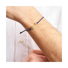 Adjustable blue bracelet by Endless, golden anchor-shaped cross