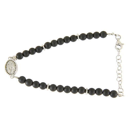 Bracelet with opaque hematite balls, details and Saint Rita medalet with white zircons 2