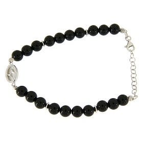 Bracelet with white and silver zircons, Saint Rita medal and black onyx beads