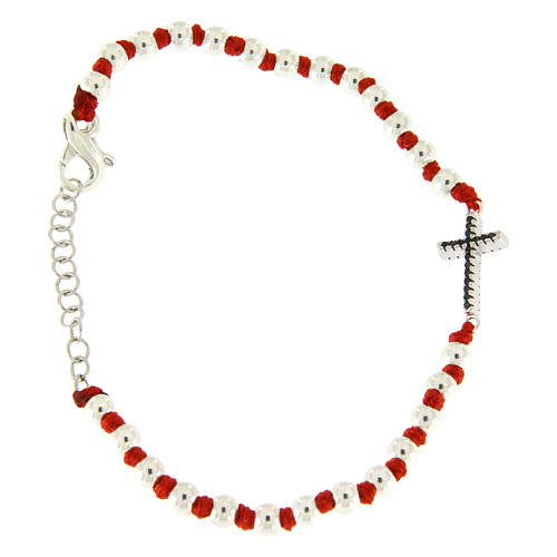 Bracelet with silver spheres sized 3 mm, red cotton knots and black zirconate cross 1