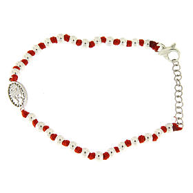 Bracelet with silver spheres sized 3 mm, red cotton knots, Saint Rita medalet and white zirconate cross