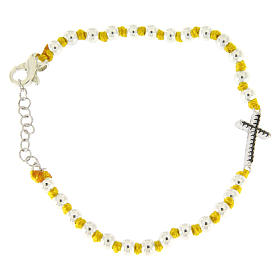 Bracelet with black zirconate cross and 3 mm silver spheres separated by yellow knots