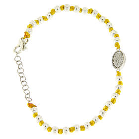 Bracelet with Saint Rita medalet and white zircons, with 3 mm spheres and yellow cotton knots