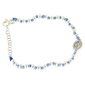 Bracelet with Saint Rita medalet in silver and white zircons, 3 mm spheres and light blue cotton knots