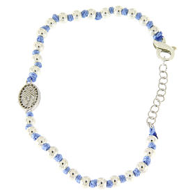 Bracelet with Saint Rita medalet in silver and white zircons, 3 mm spheres and light blue cotton knots