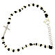 Bracelet with multifaceted silver beads sized 2 mm on a black cotton cord and a white zirconate cross s1