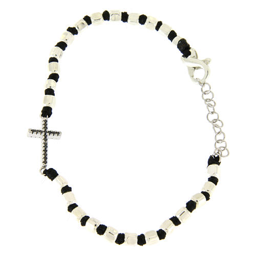 Bracelet with multifaceted silver beads sized 2 mm on a black cotton cord and a black zirconate cross 1