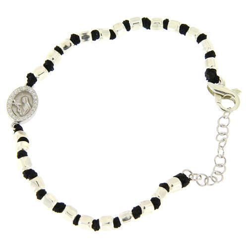 Bracelet with multifaceted silver beads sized 2 mm on a black cotton cord and a black zirconate Saint Rita medalet 1