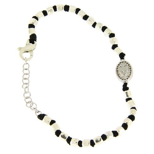 Bracelet with multifaceted silver beads sized 2 mm on a black cotton cord and a black zirconate Saint Rita medalet 2