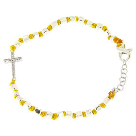 Bracelet with multifaceted spheres sized 2 mm with white zirconate cross and yellow cotton cord