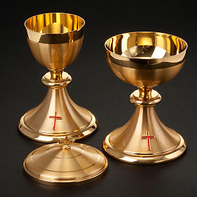 Golden chalice and ciborium with cross
