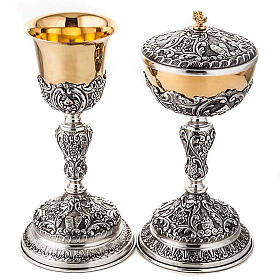 Silver chalice and ciborium tables of the Law