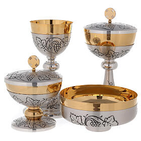 Chalice, ciborium and paten with brunches of grapes