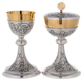 Chalice, ciborium and paten with brunches of grapes