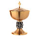 Chalice, ciborium and paten with Miracles relief on node s5