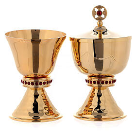 Chalice and ciborium in brass with hammered base and decorated with red stones