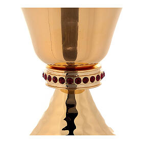 Chalice and ciborium in brass with hammered base and decorated with red stones