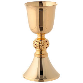 Brass chalice and ciborium with red stones on the node