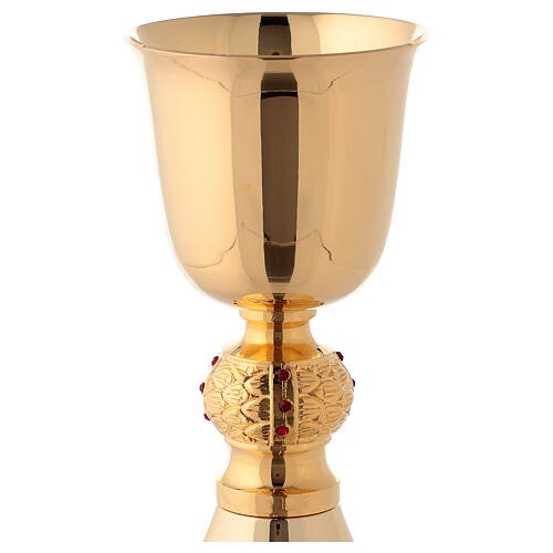Brass chalice and ciborium with red stones on the node 4