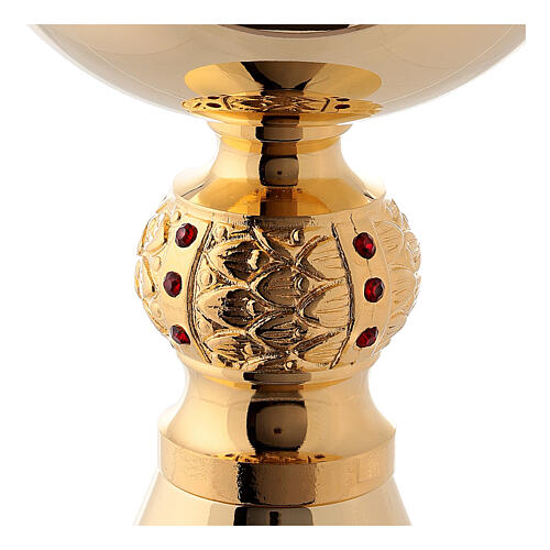 Brass chalice and ciborium with red stones on the node 5