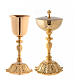 Golden brass chalice and pyx with floral base s1