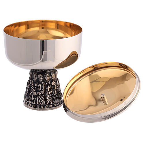 Chalice, ciborium and bowl paten of silver-plated brass, base with embossed apostles 7