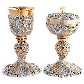 Two-tone chalice and ciborium with swirls and red stone node