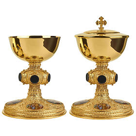 Molina chalice, paten and pyx in gold plated silver with black onyx stones and scenes of Jesus' life