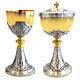 Chiselled silver chalice and ciborium with JHS and Chi-Rho symbols s1
