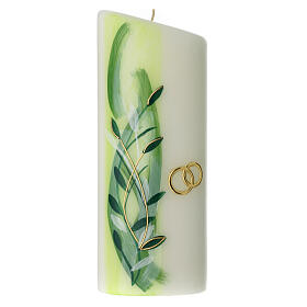 Oval candle, golden wedding ring and green leaves, 230x90 mm