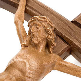 Dark wood curved cross, patinated Christ's body