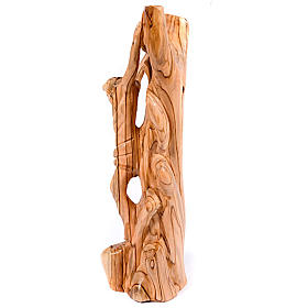 Olive wood crucifix on trunk